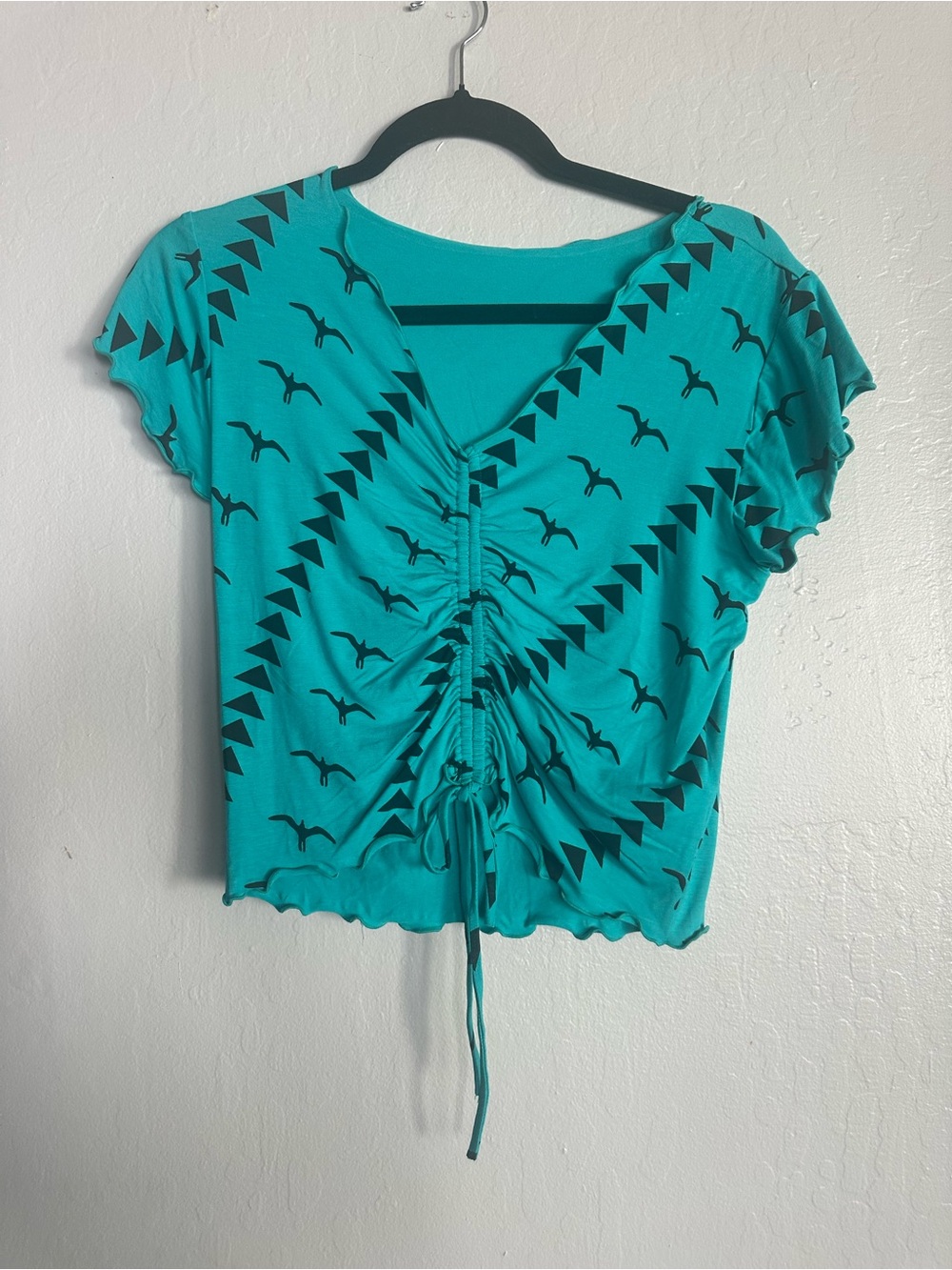 Lavish Alice Turquoise Drawstring V-Neck Crop Top with Black Print